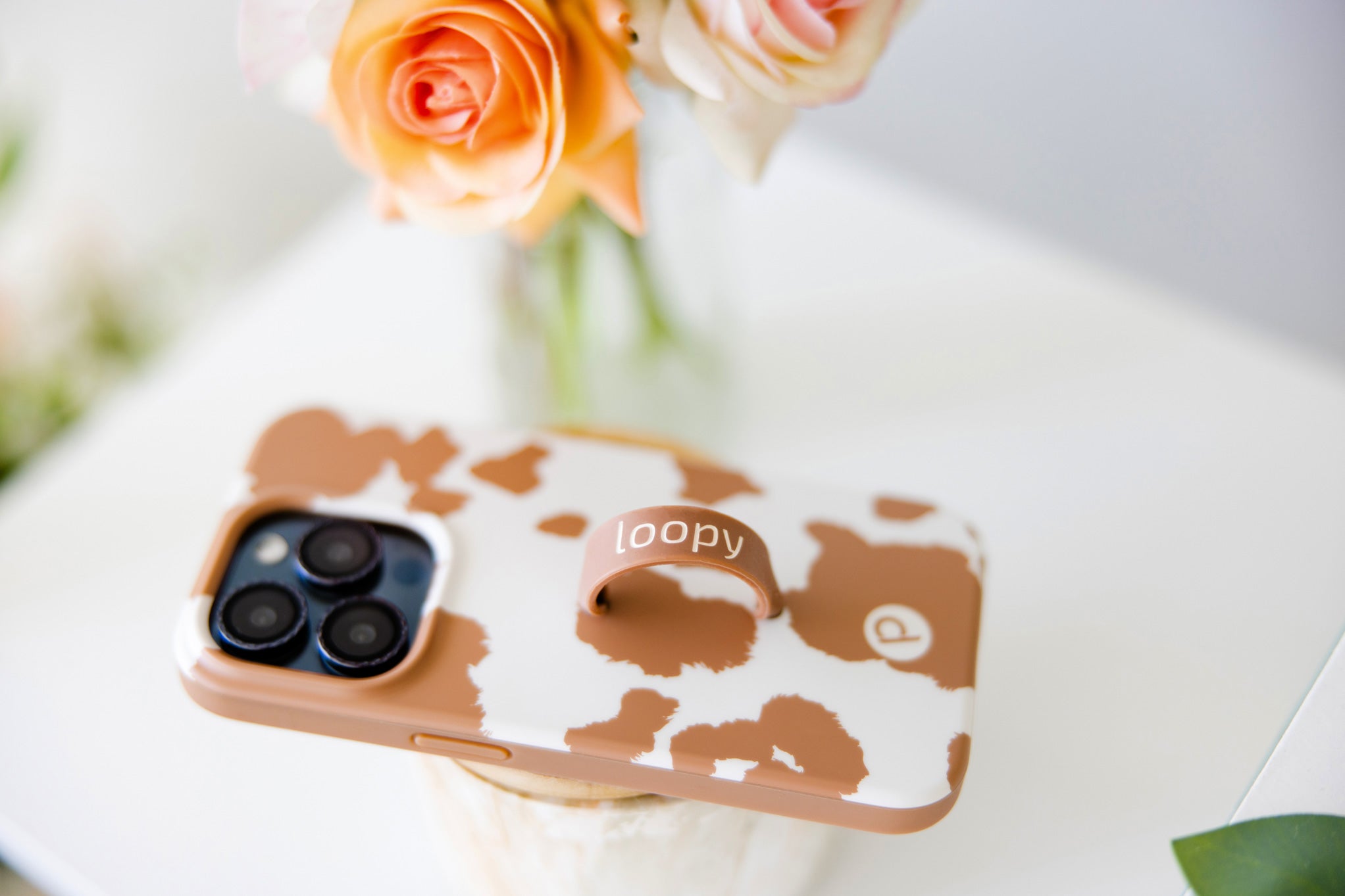 A Brown Cow Print Loopy Case.