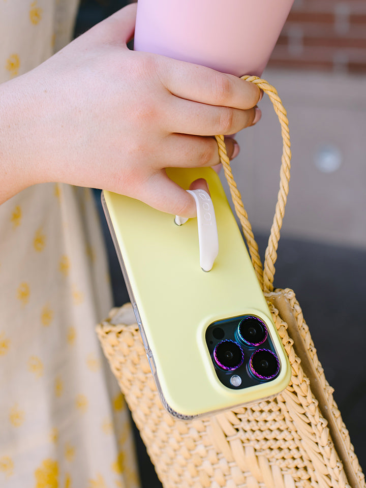 A woman holding a Honeybee Loopy Case. || feature-media