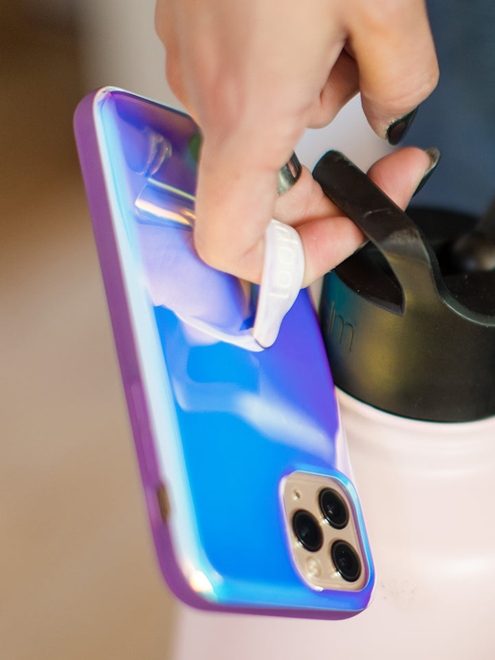 A woman holding a Violet Quartz Loopy Case. || feature-media