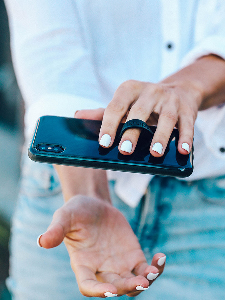 A woman holding a Black Ombre Loopy Case.|| feature-media