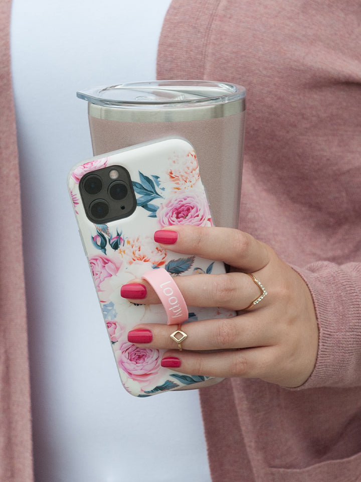 A woman holding a Blossom Loopy Case. || feature-media