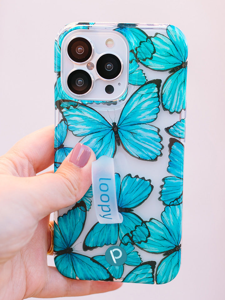  A woman holding a Butterflies Loopy Case.|| feature-media