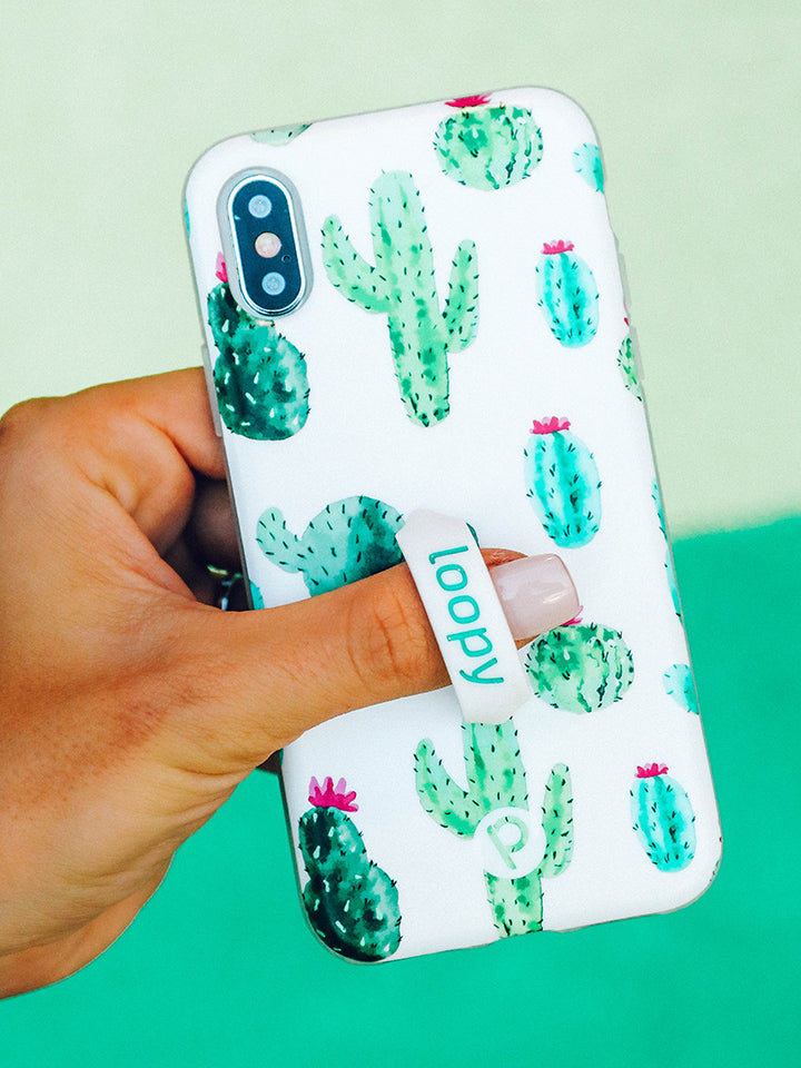 A woman holding a Cactus Loopy Case.|| feature-media