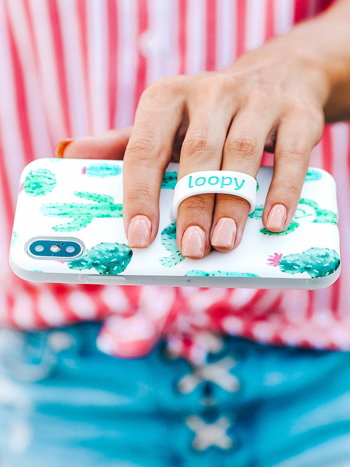  A woman holding a Cactus Loopy Case.|| feature-media