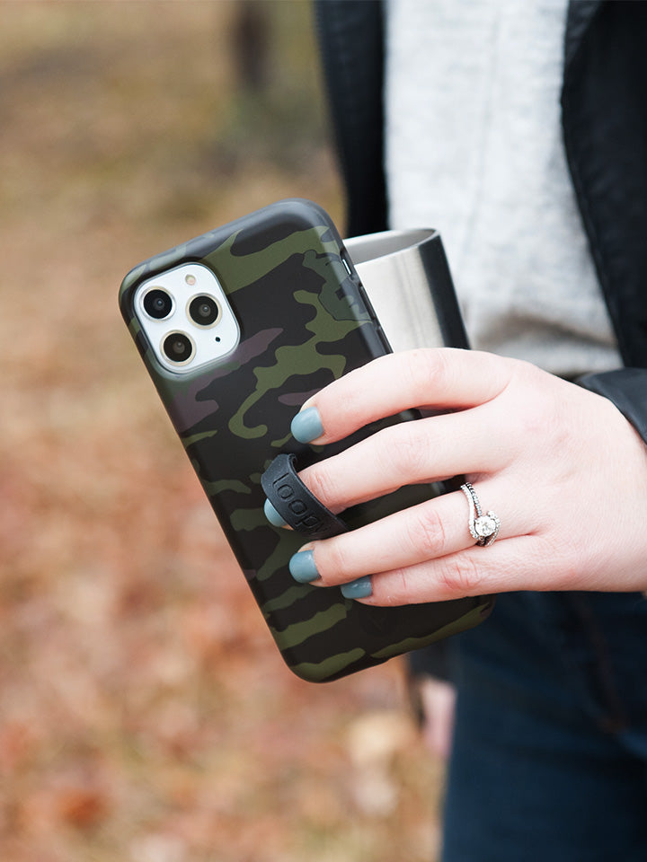 A woman holding a Camo Loopy Case. || feature-media