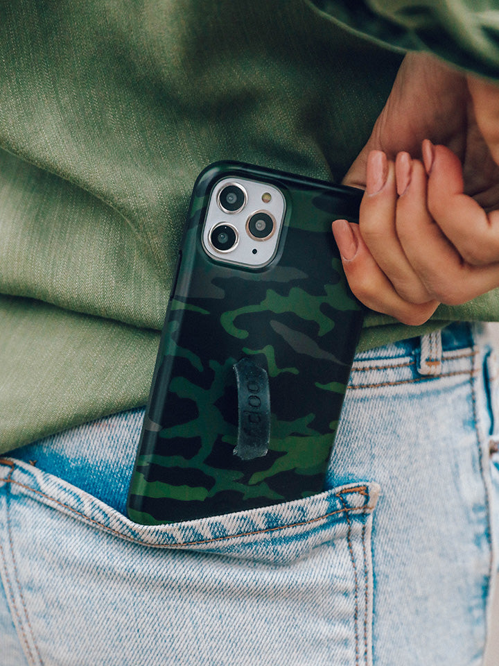 A woman putting a Camo Loopy Case in her pocket. || feature-media