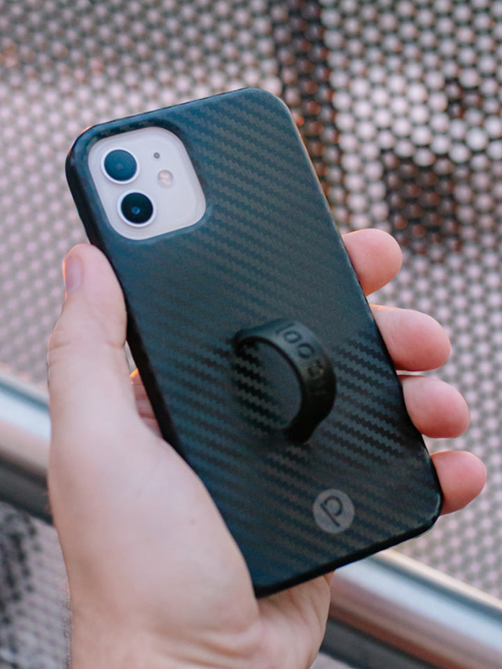 A man holding a Carbon Loopy Case.|| feature-media