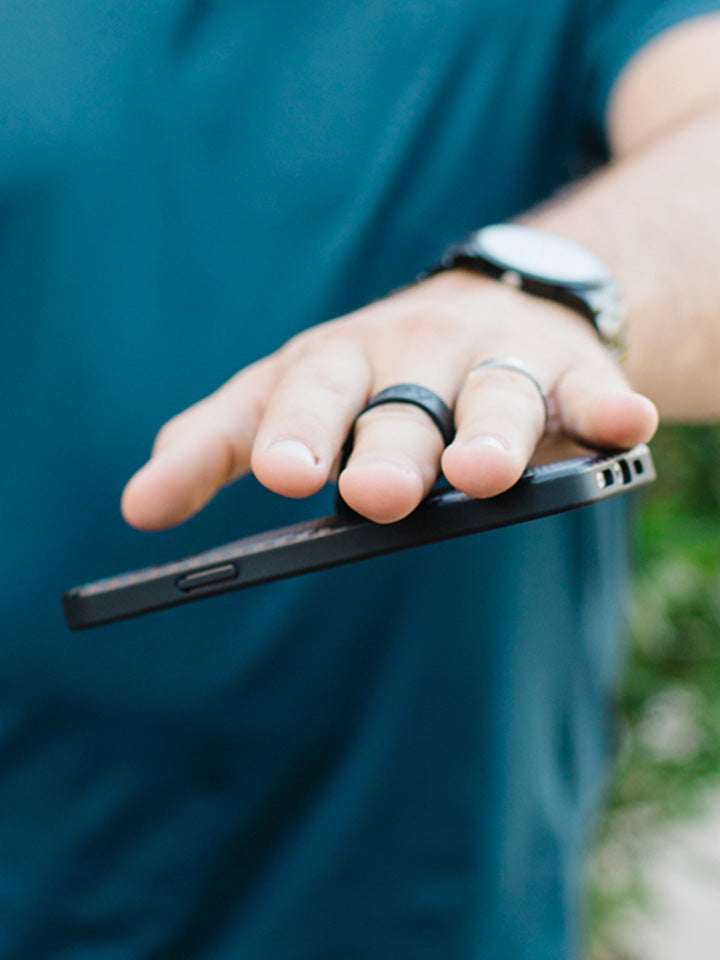 A man holding a Carbon Loopy Case.|| feature-media