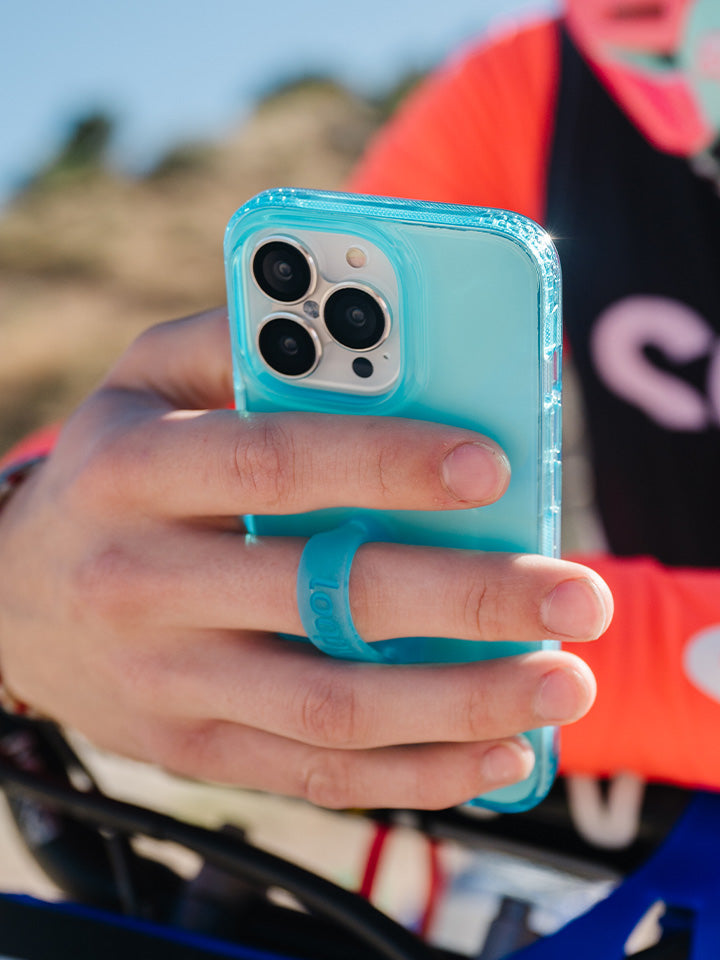 A man holding a Clear Neon Blue Loopy Case. || feature-media