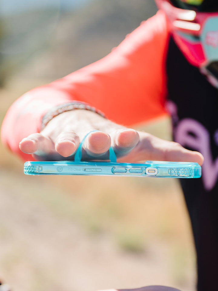 A man holding a Clear Neon Blue Loopy Case. || feature-media