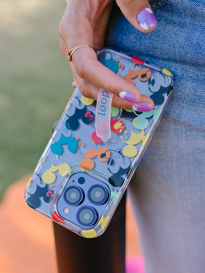 A woman holding a Colorful Mickeys Loopy Case. || feature-media