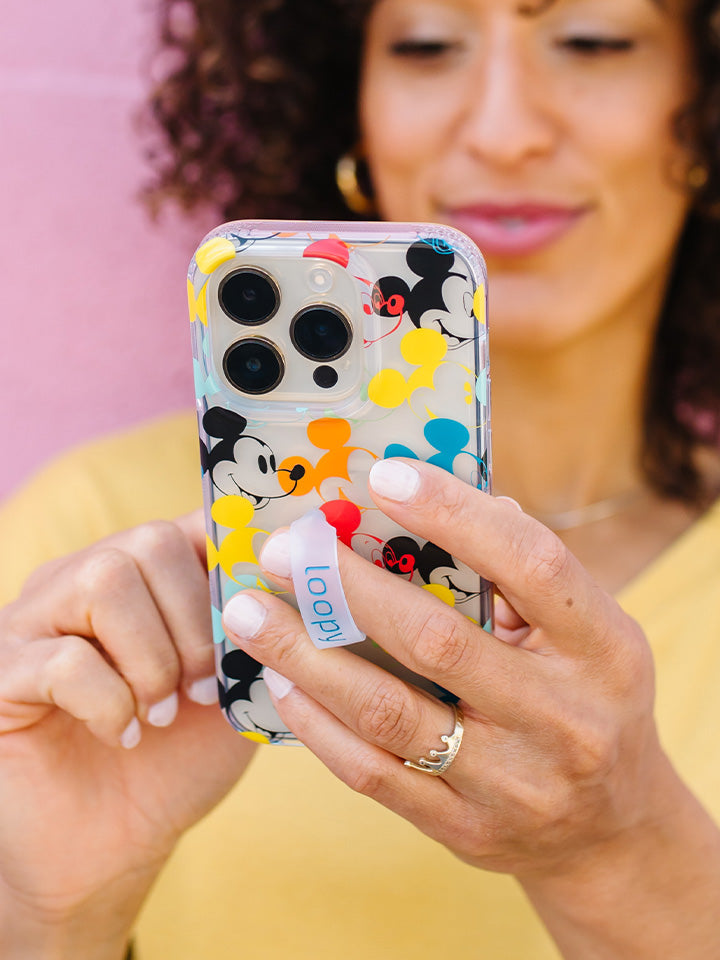  A woman holding a Colorful Mickeys Loopy Case.|| feature-media