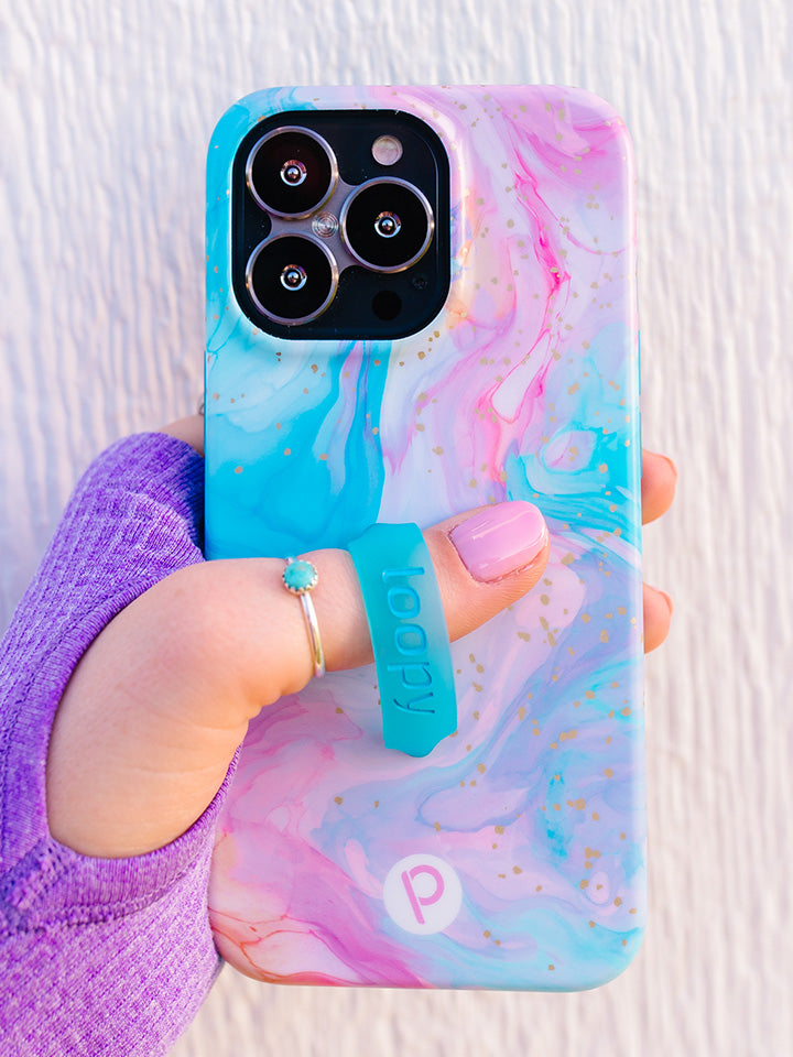 A woman holding a Cotton Candy Swirl Loopy Case. || feature-media