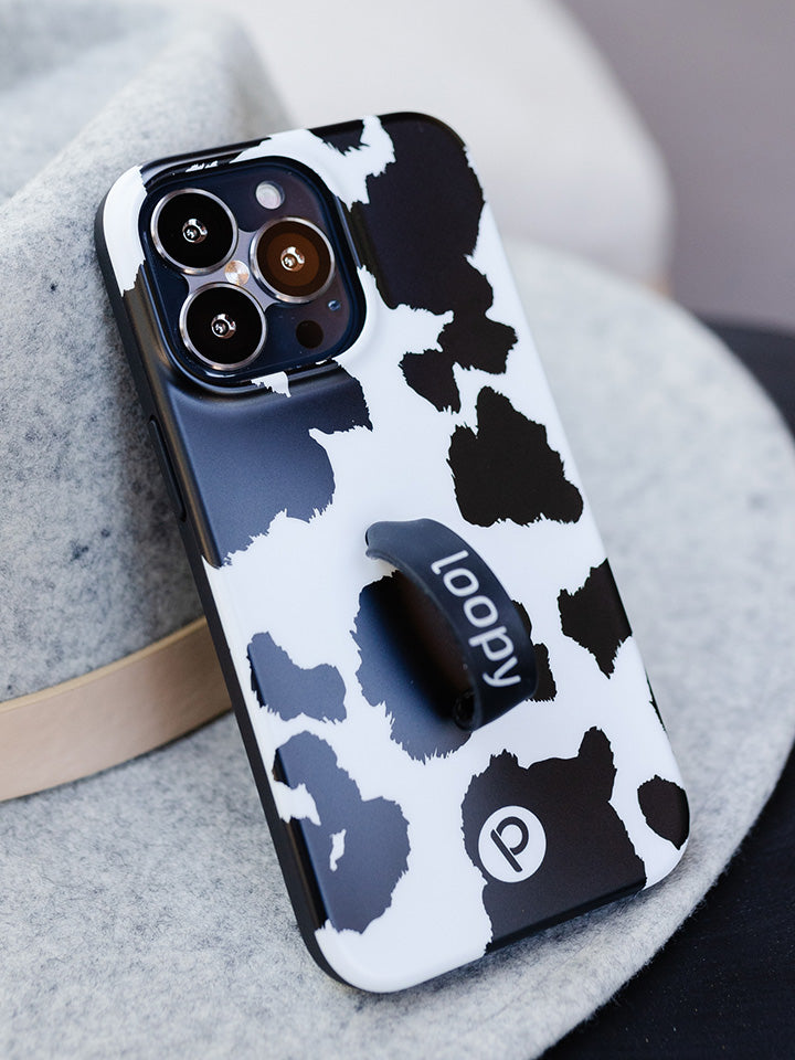 A Cow Print Loopy Case.|| feature-media