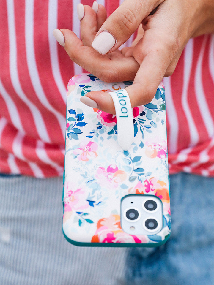  A woman holding a Gardenia Loopy Case.|| feature-media