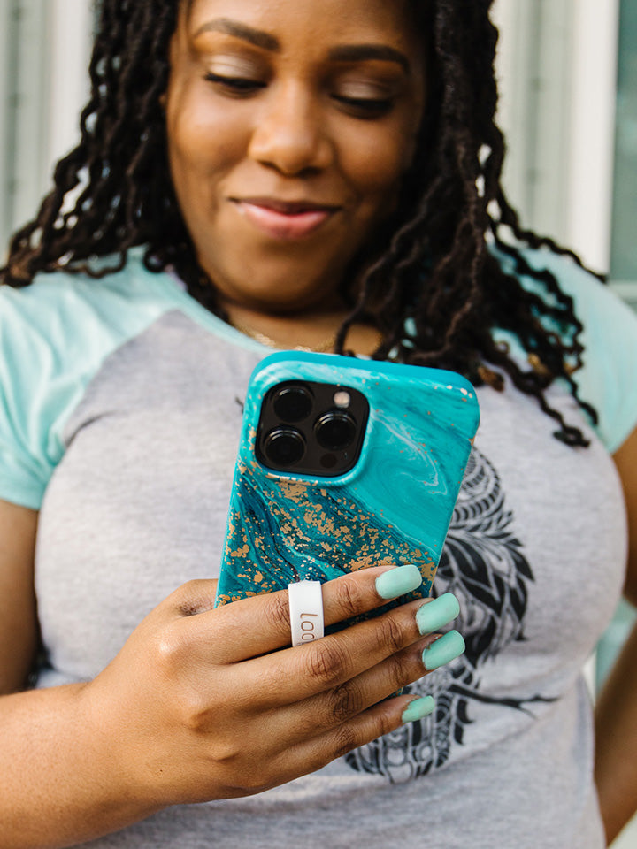 A woman holding a Jasper Loopy Case. || feature-media