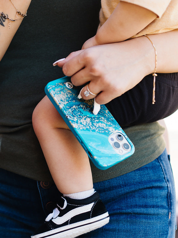 A woman holding a Jasper Loopy Case. || feature-media