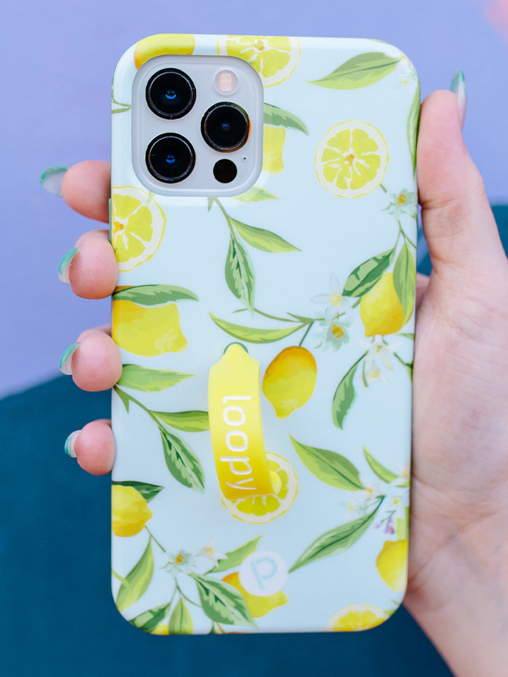 A woman holding a Lemons Loopy Case. || feature-media