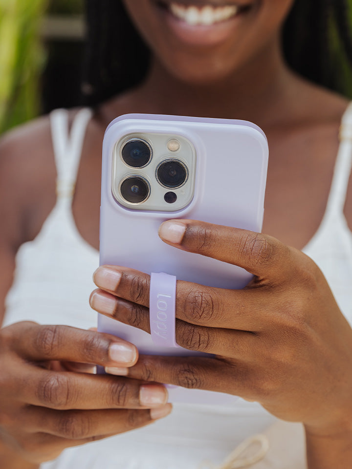  A woman holding a Lilac Loopy Case.|| feature-media