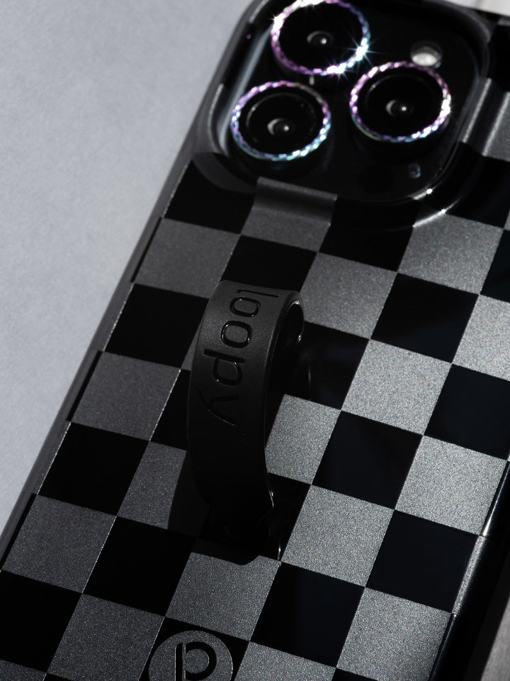 A close up of a Midnight Checkered Loopy Case. || feature-media