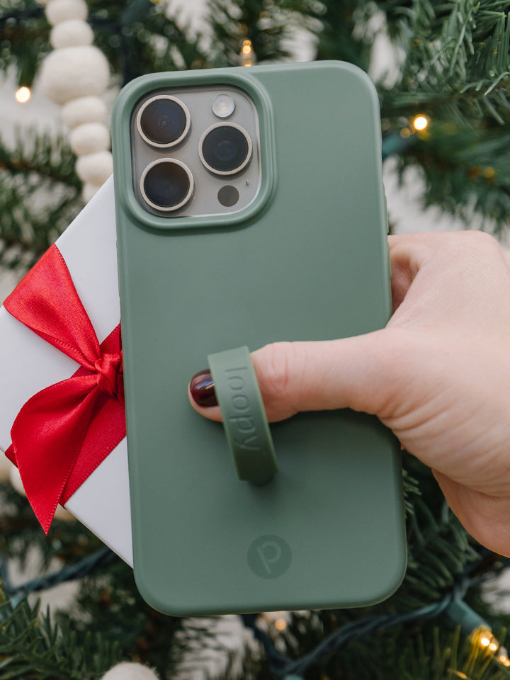 A woman holding an Olive Loopy Case. || feature-media