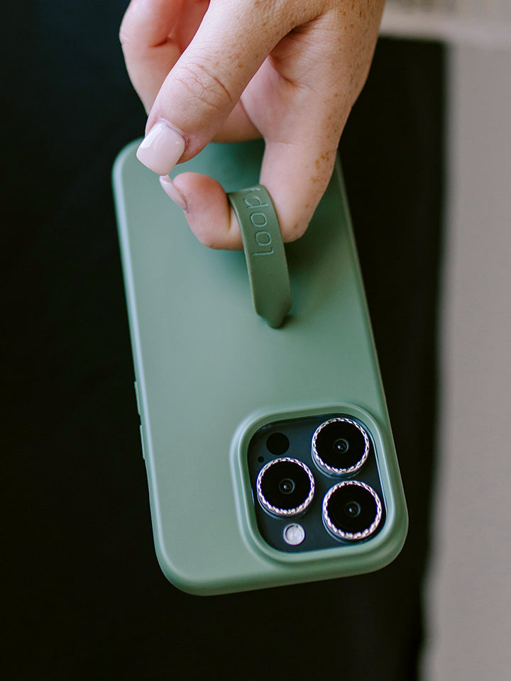 A woman holding an Olive Loopy Case. || feature-media