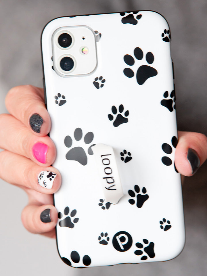 A woman holding a Pawprints Loopy Case. || feature-media