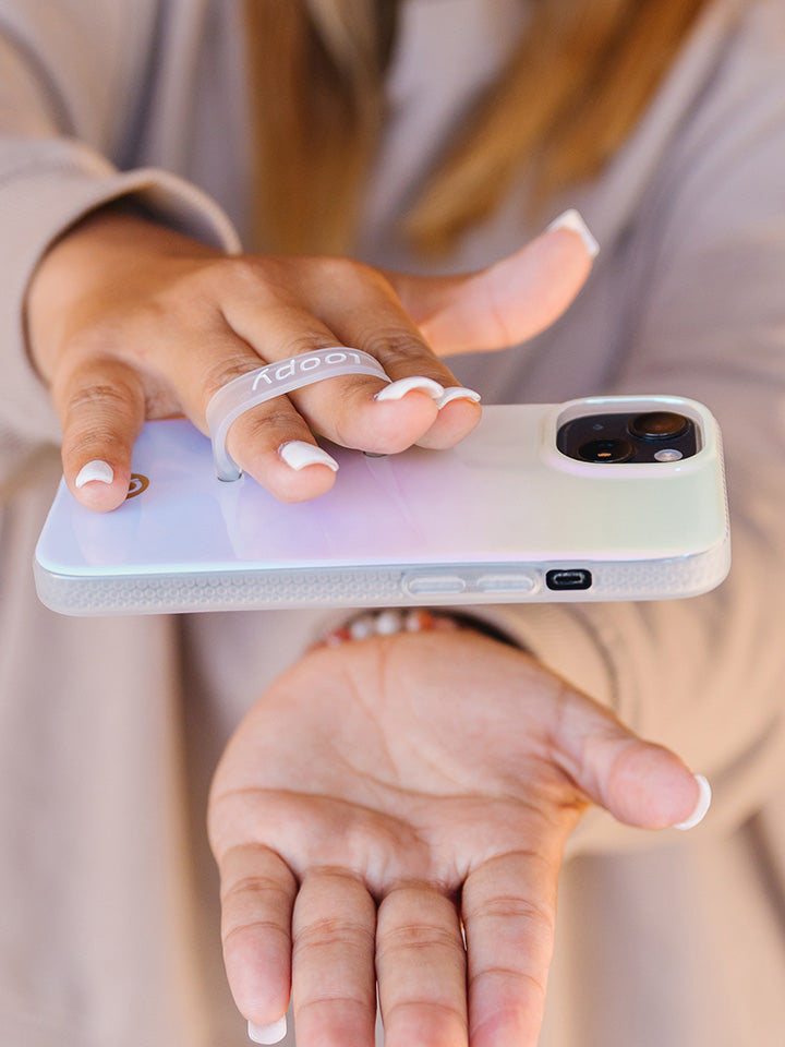 A woman holding a Pearl Loopy Case. || feature-media