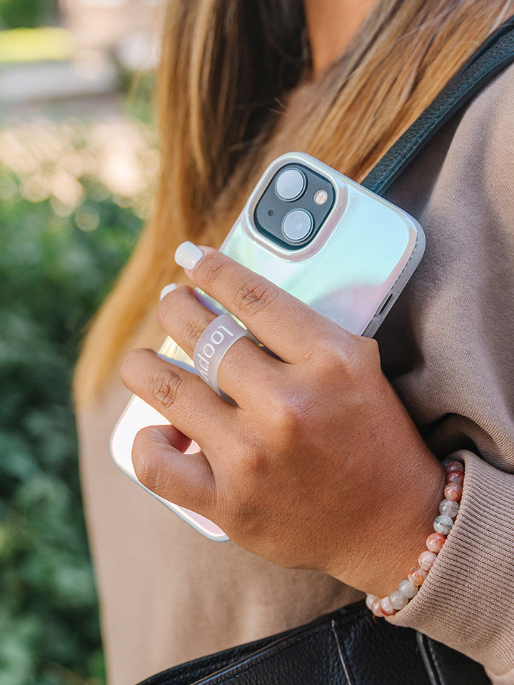 A woman holding a Pearl Loopy Case. || feature-media