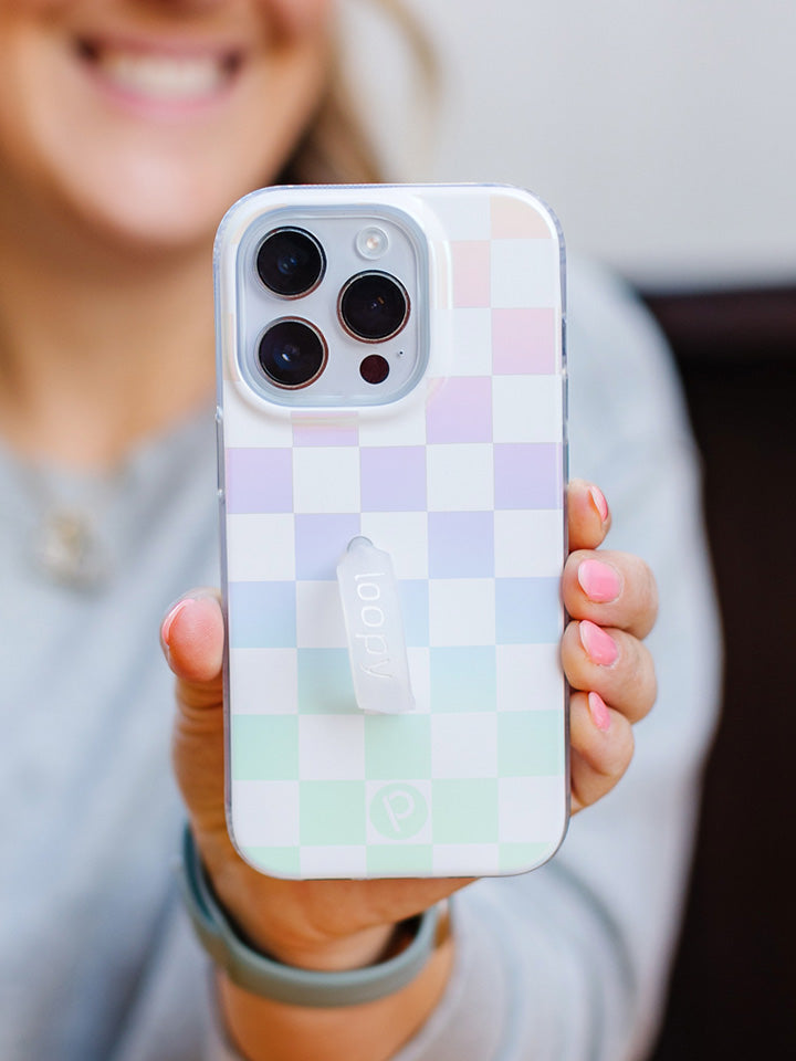 A woman holding a Pearl Checkered Loopy Case.|| feature-media