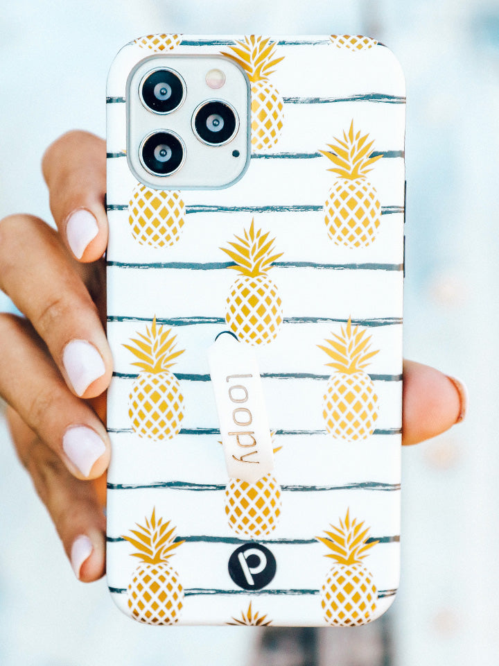 A woman holding a Pineapple Loopy Case. || feature-media