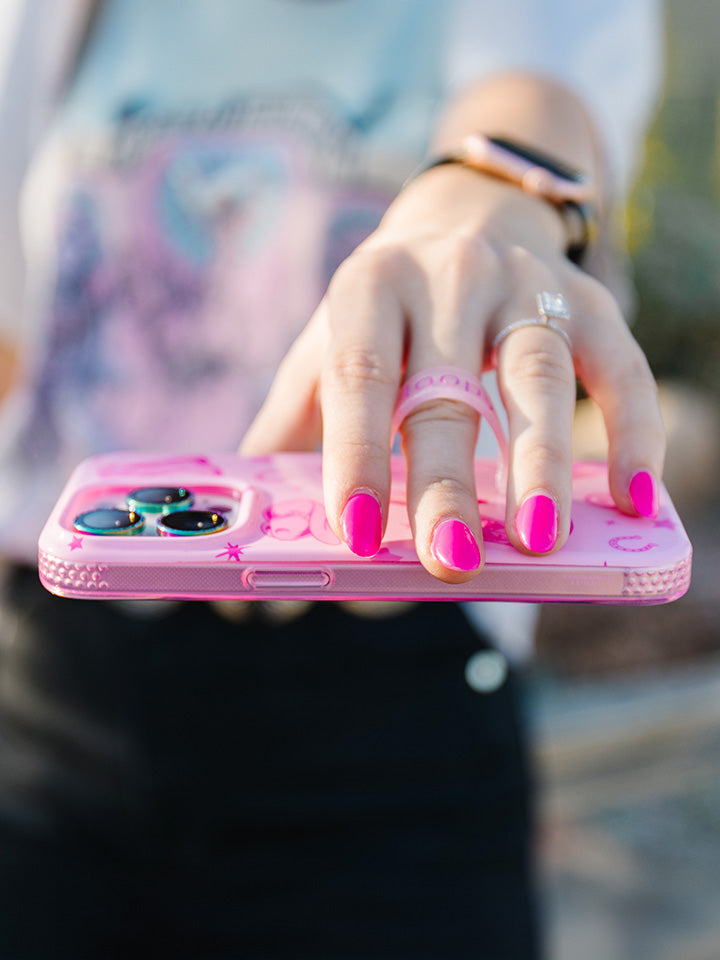 A woman holding a Pink Boots Loopy Case.|| feature-media