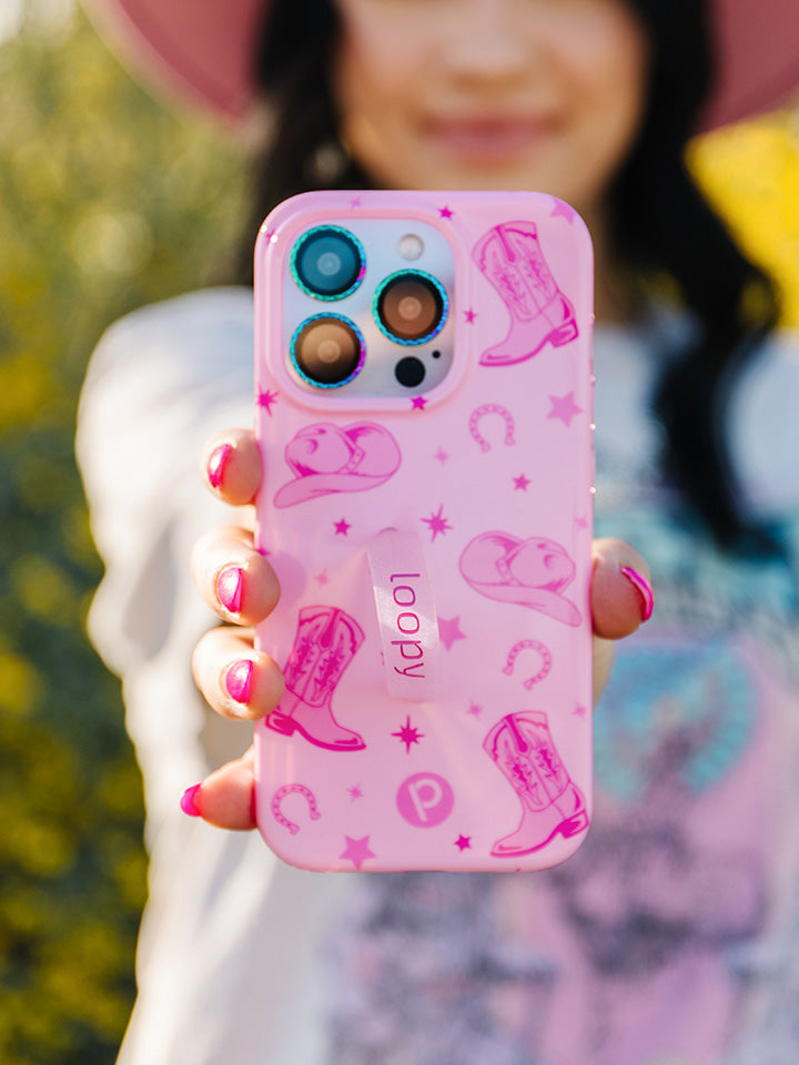 A woman holding a Pink Boots Loopy Case.|| feature-media