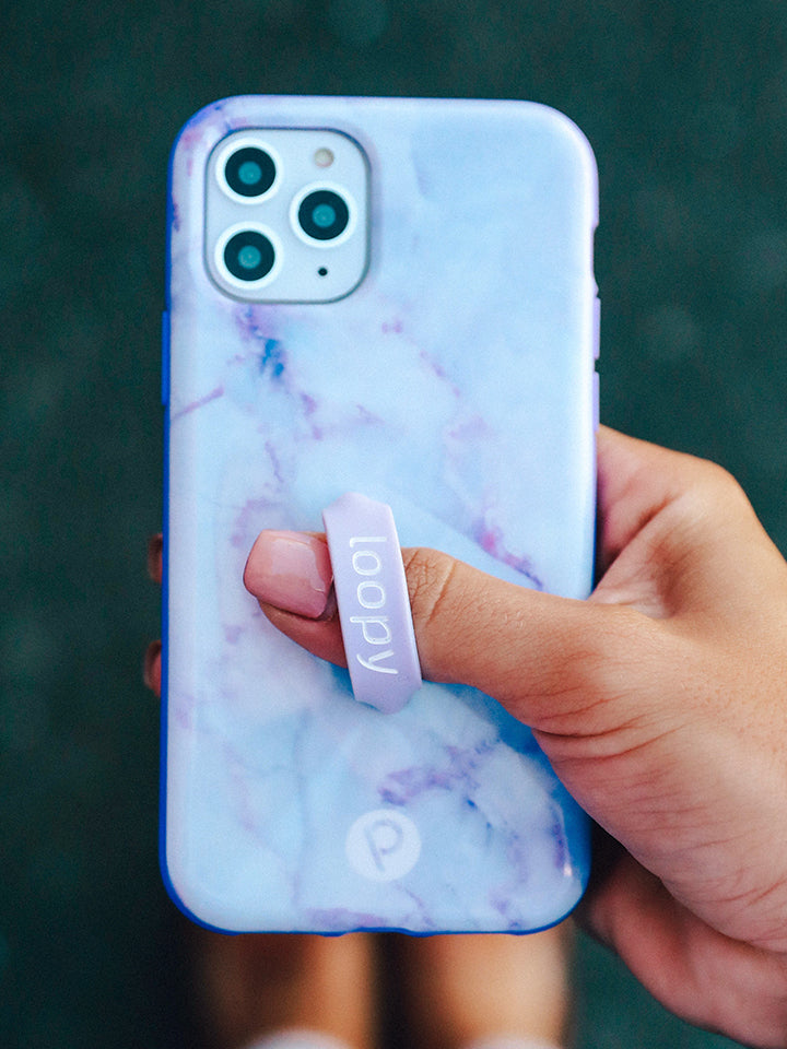 A woman holding a Purple Marble Loopy Case.