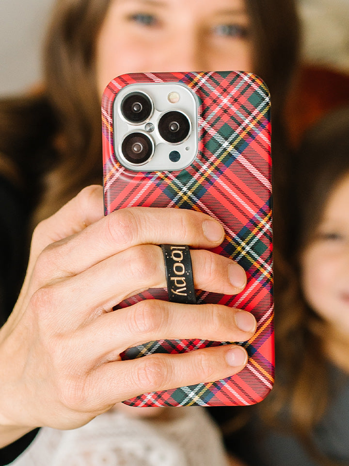 A woman holding a Red Tartan Plaid Loopy Case. || feature-media