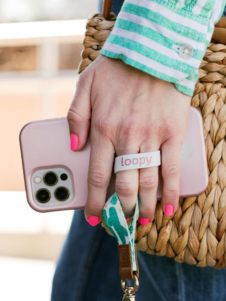 A woman holding a Rose Gold Loopy Case.|| feature-media