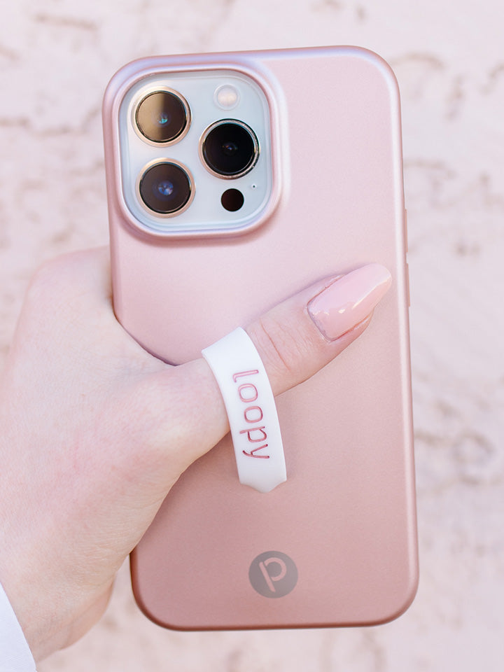 A woman holding a Rose Gold Loopy Case.|| feature-media