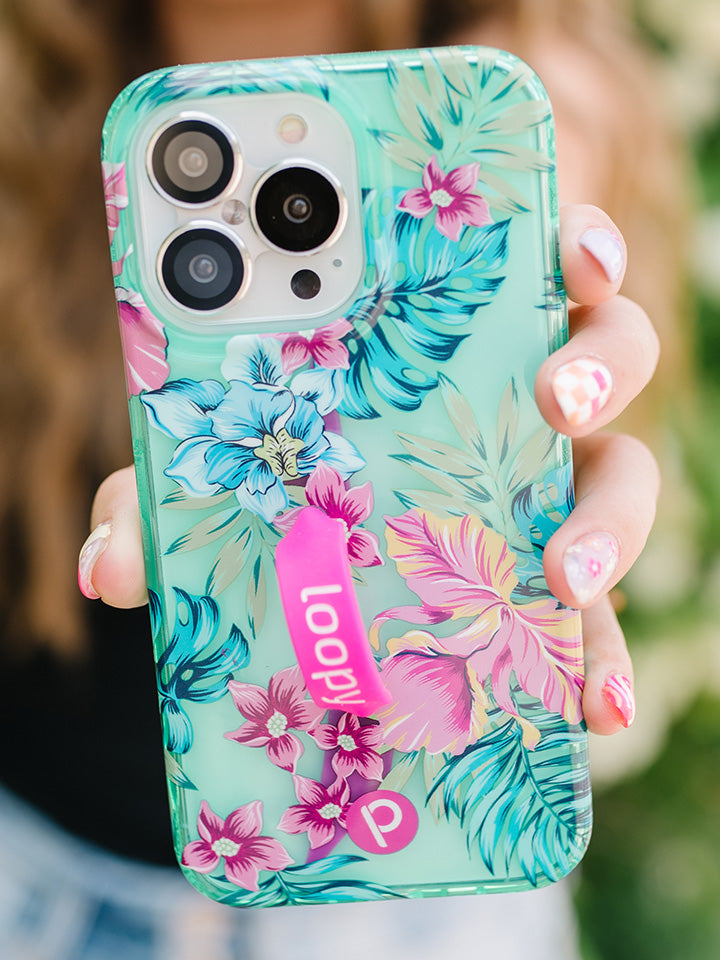 A woman holding a Clear Sea Glass Floral Loopy Case. || feature-media