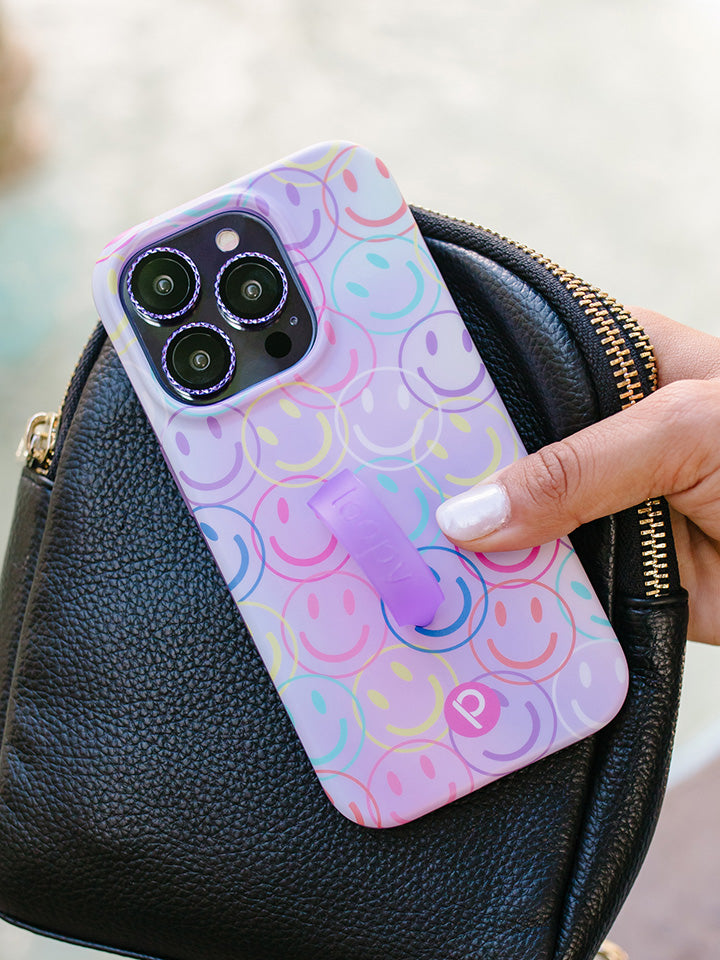 A woman holding a Smileys Loopy Case.|| feature-media