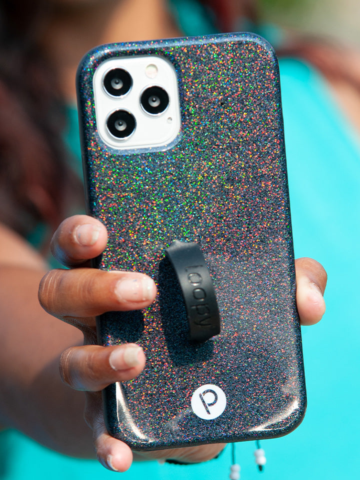 A woman holding a Sparkle Black Loopy Case.|| feature-media