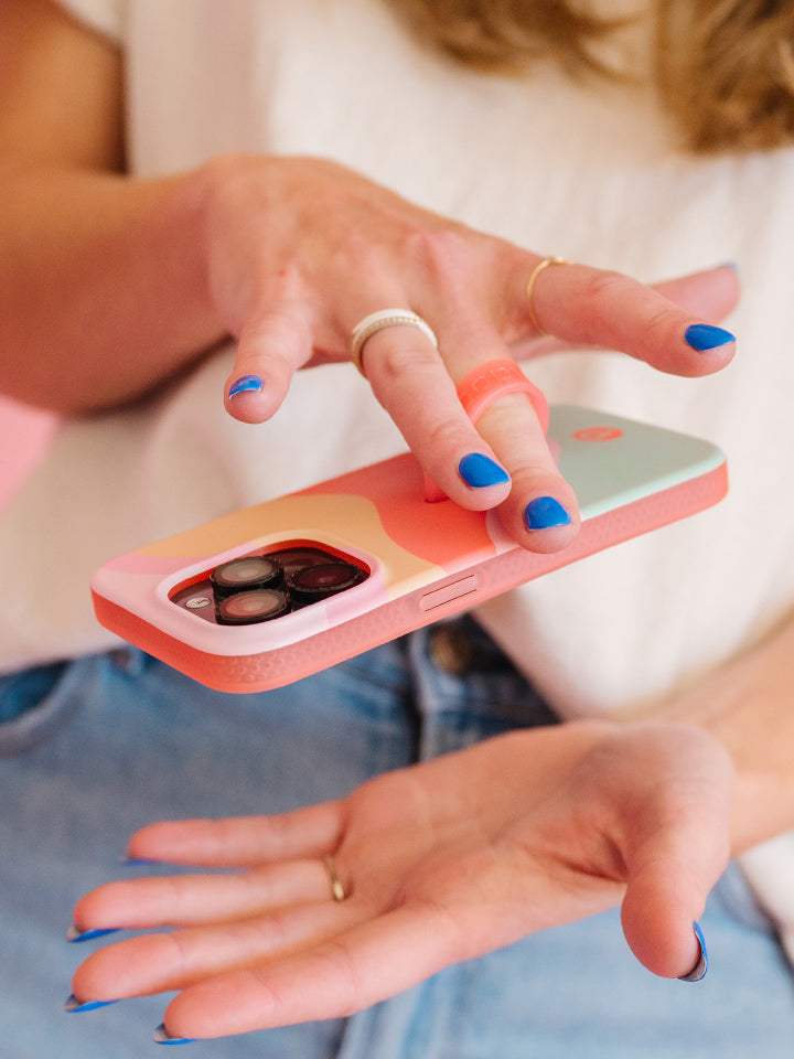 A woman holding a Sweet Sorbet Loopy Case. || feature-media