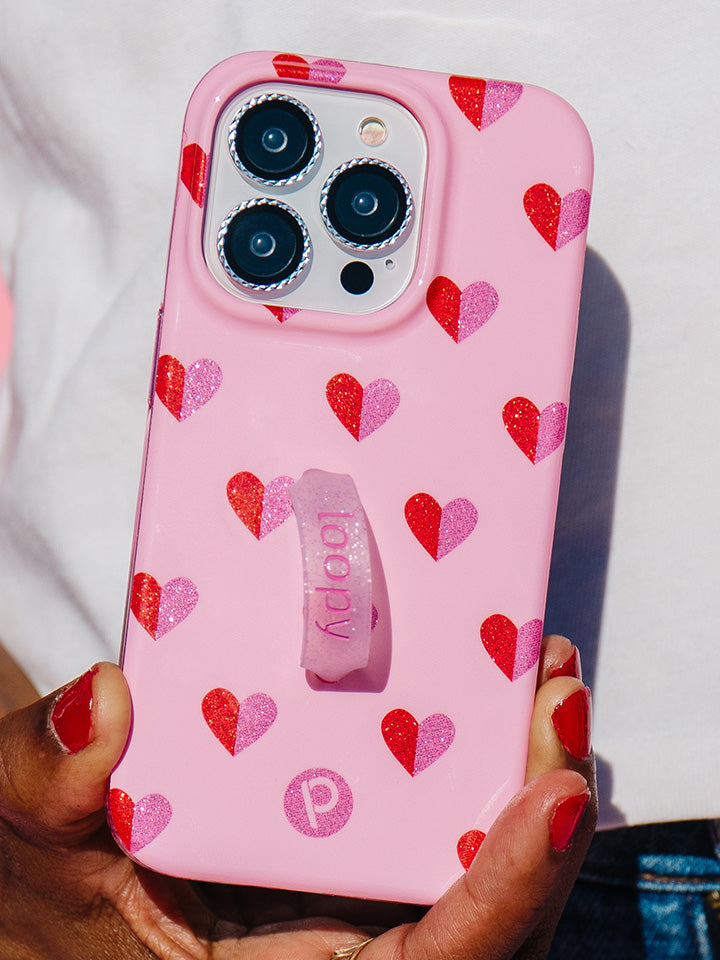 A woman holding a Sweetheart Sparkle Loopy Case. || feature-media