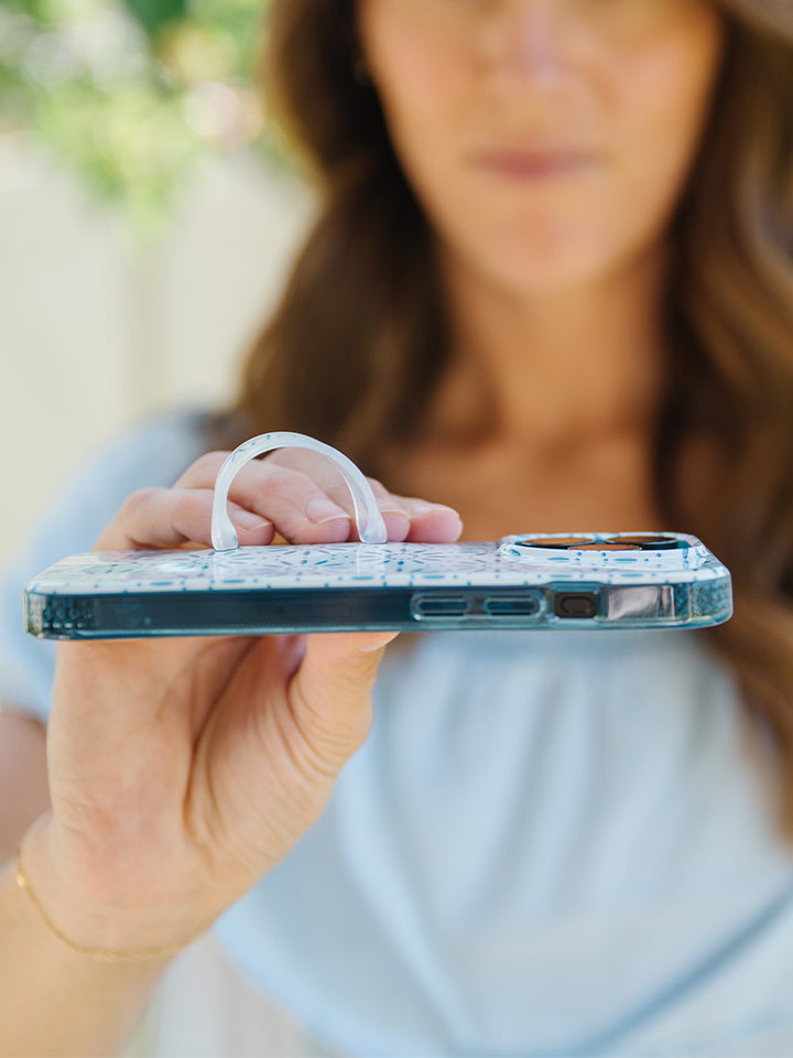 A woman holding a Talavera Loopy Case. || feature-media