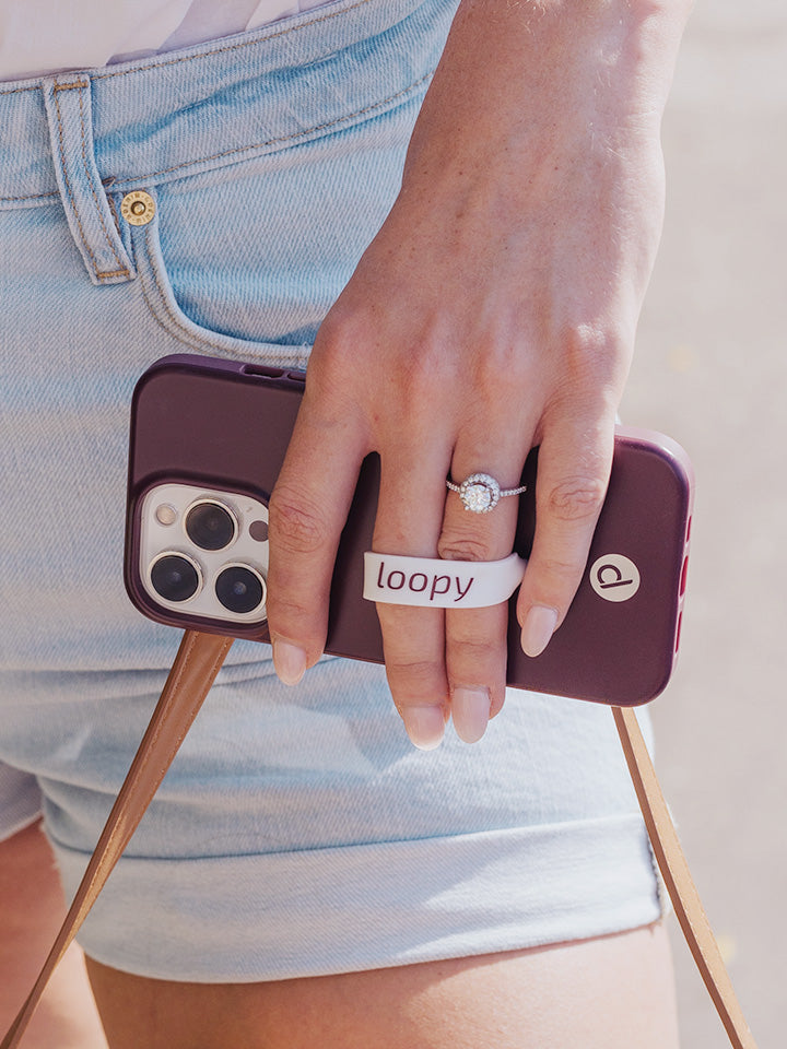 A woman holding a Wine Loopy Case.