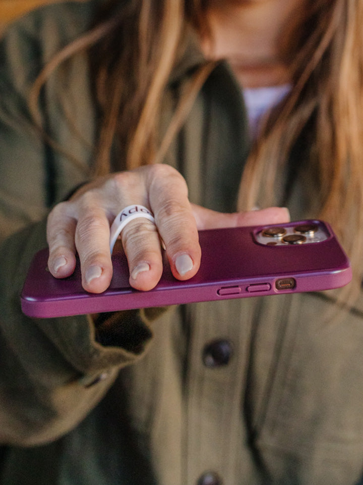 A woman holding a Wine Loopy Case.