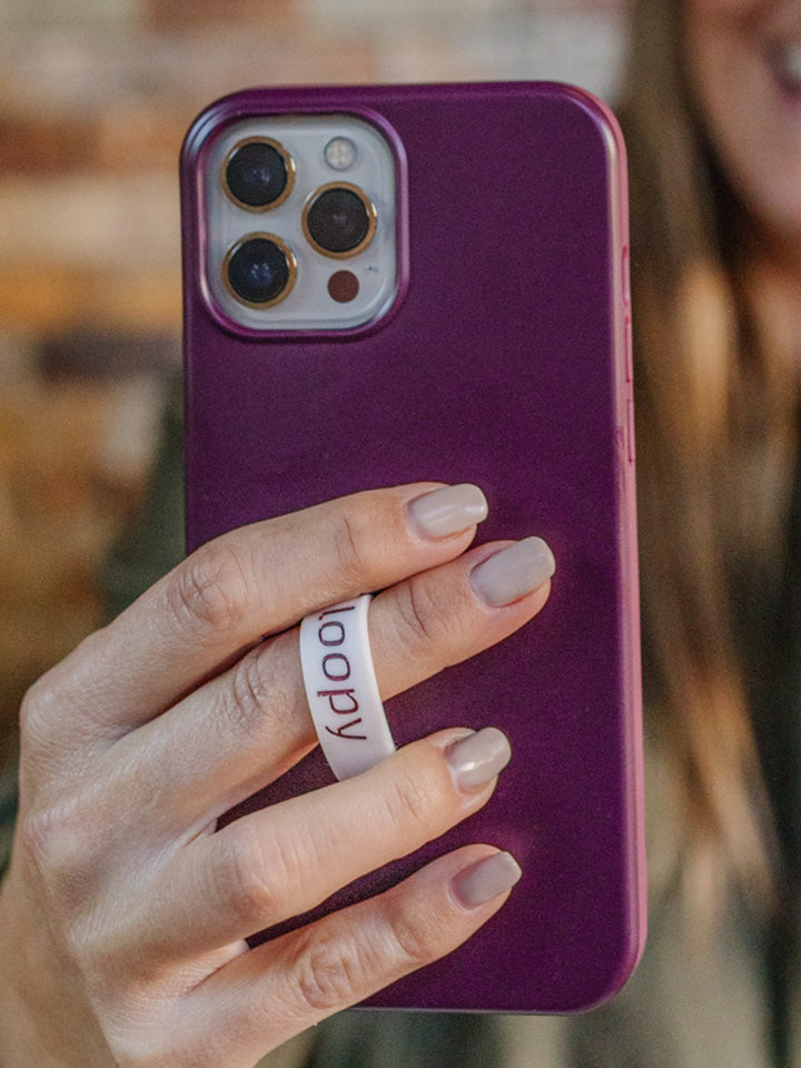 A woman holding a Wine Loopy Case.