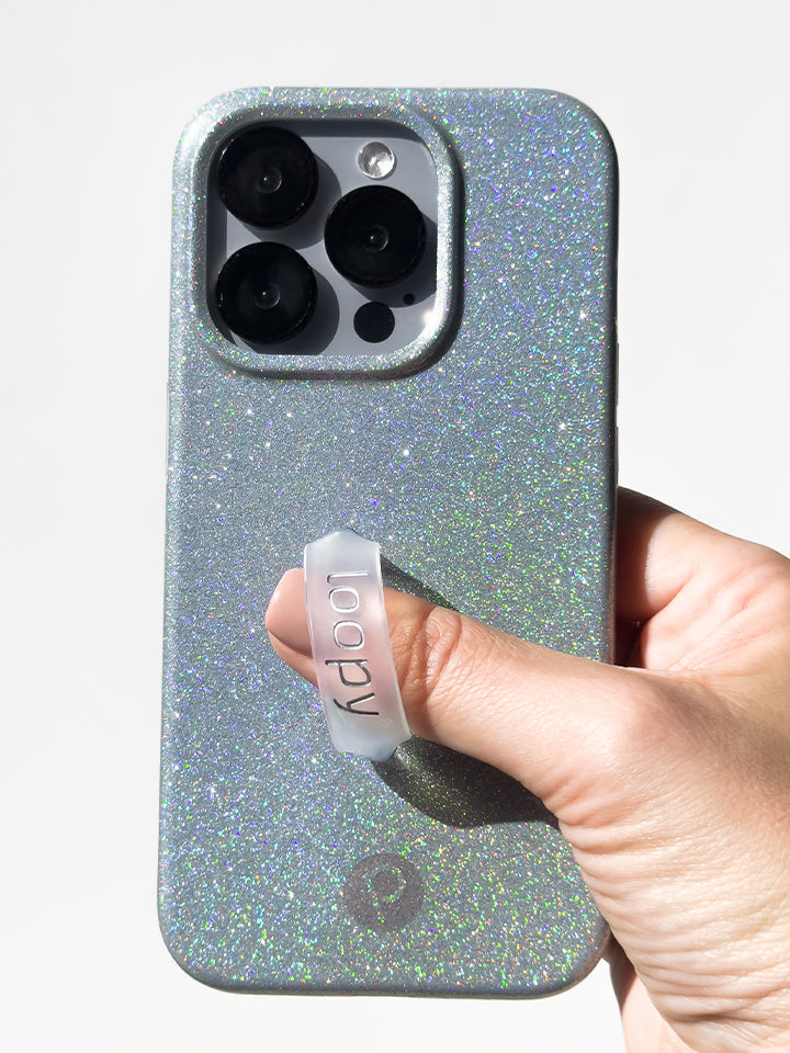 A woman holding a Platinum Sparkle Loopy Case. || feature-media