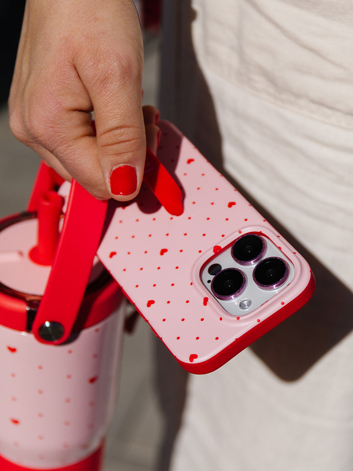 A woman holding a Be Mine Loopy Case. || feature-media