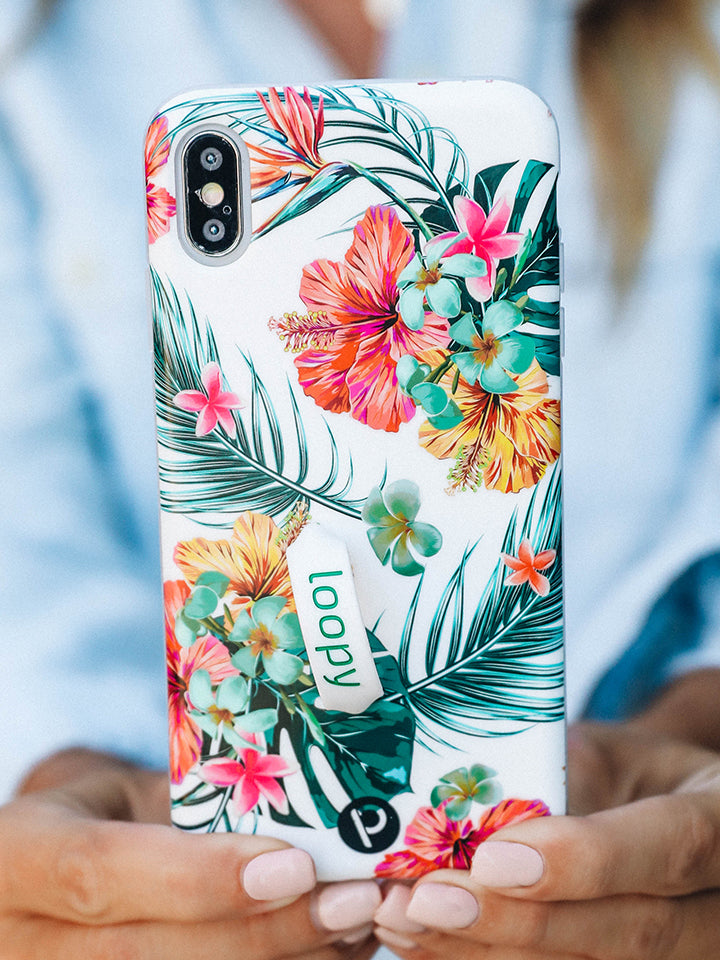 A woman holding a Tropical Hibiscus Loopy Case. || feature-media