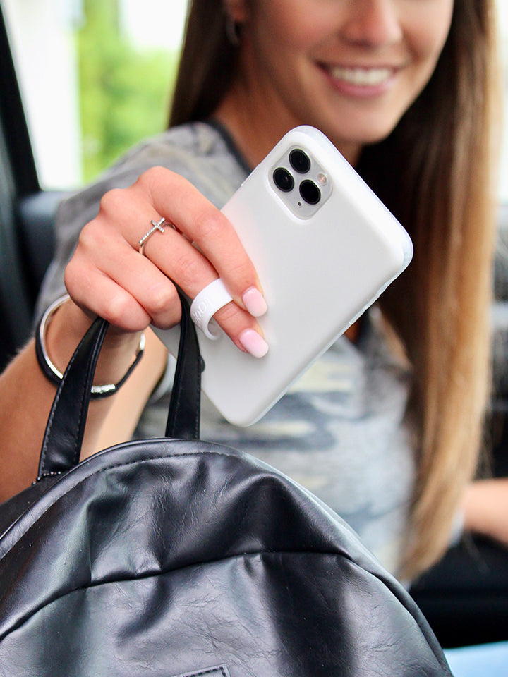 A woman holding an Opal Loopy Case. || feature-media